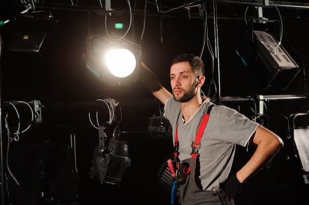 stage worker sets up lights lighting engineer adjusts lights stage scenes 104603 6224